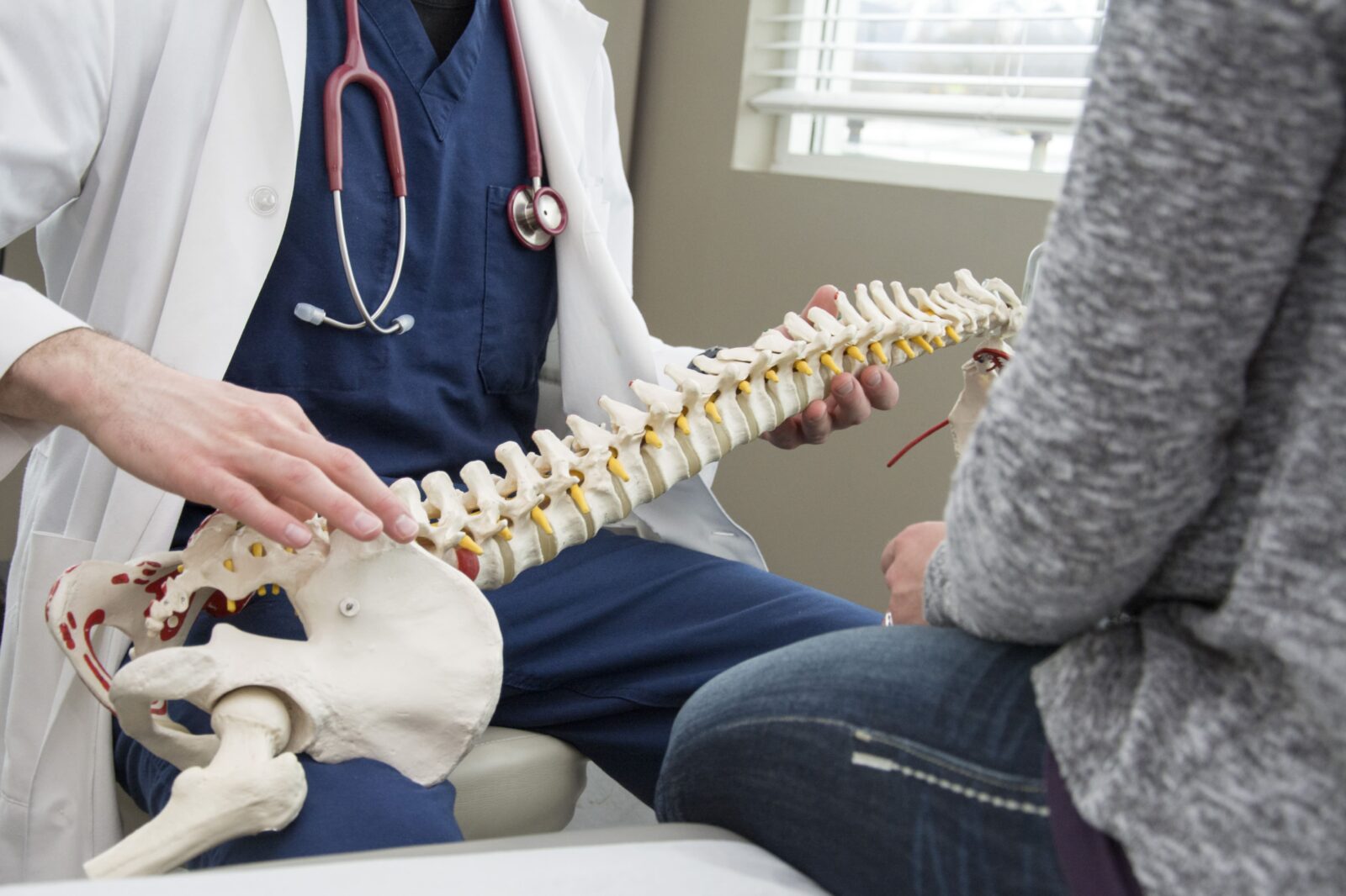 spinal surgeon talking to patient