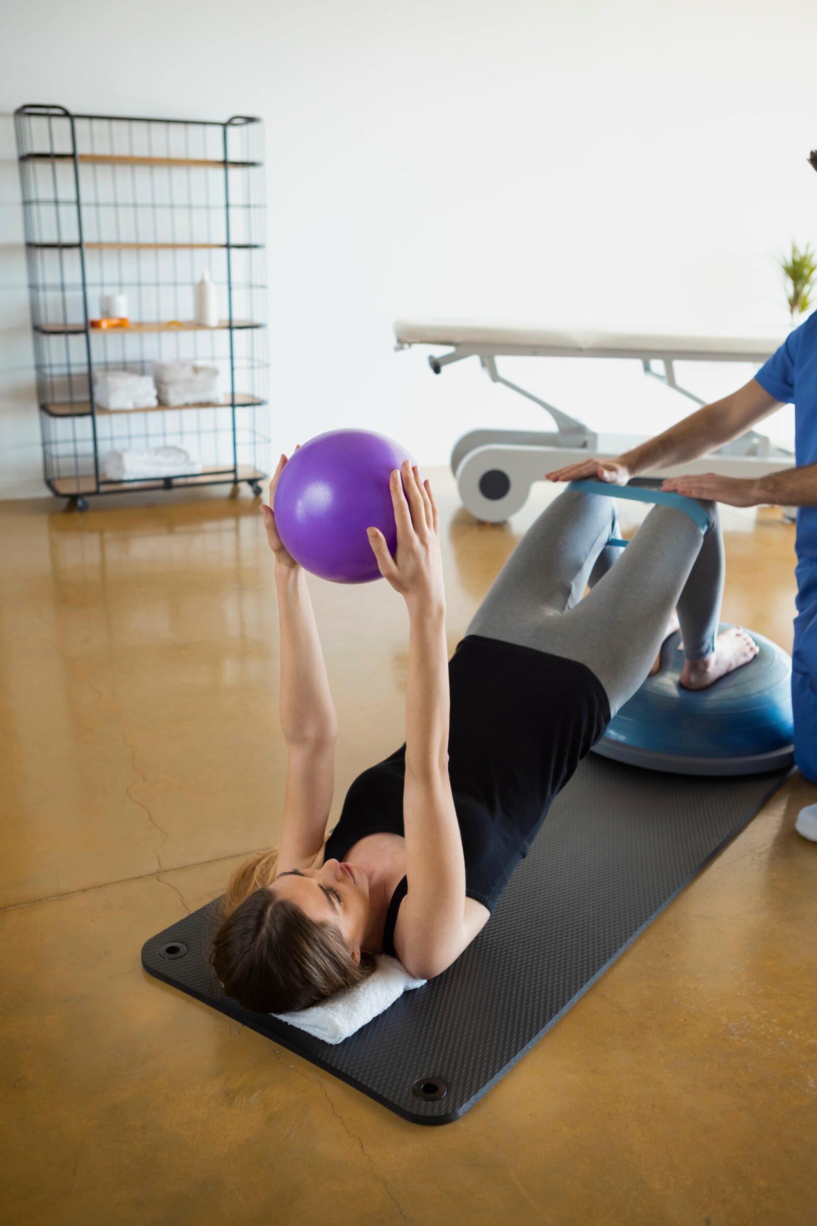 woman working on core exercises with her physical therapist