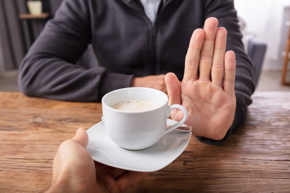 person declining coffee