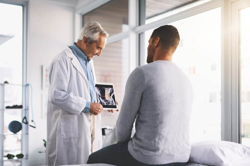 Patient and spine doctor