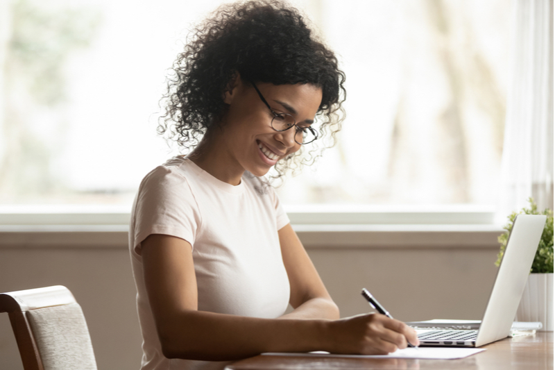 woman smiling on laptop