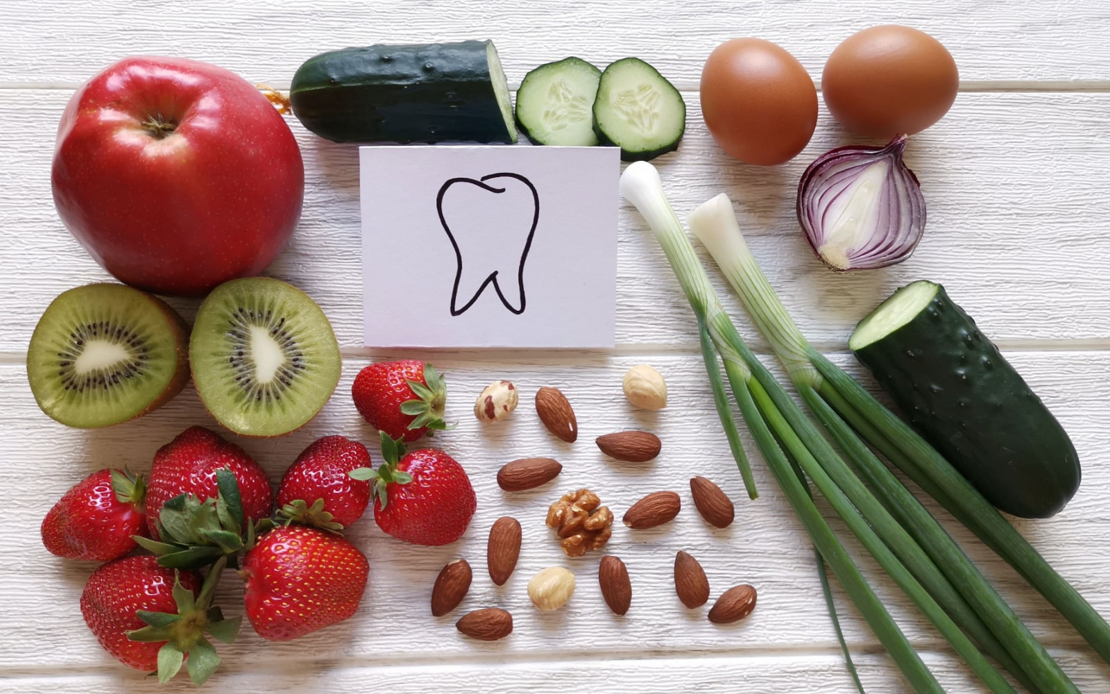 Array of Fluoride Rich Foods with a Tooth Drawing In the Center