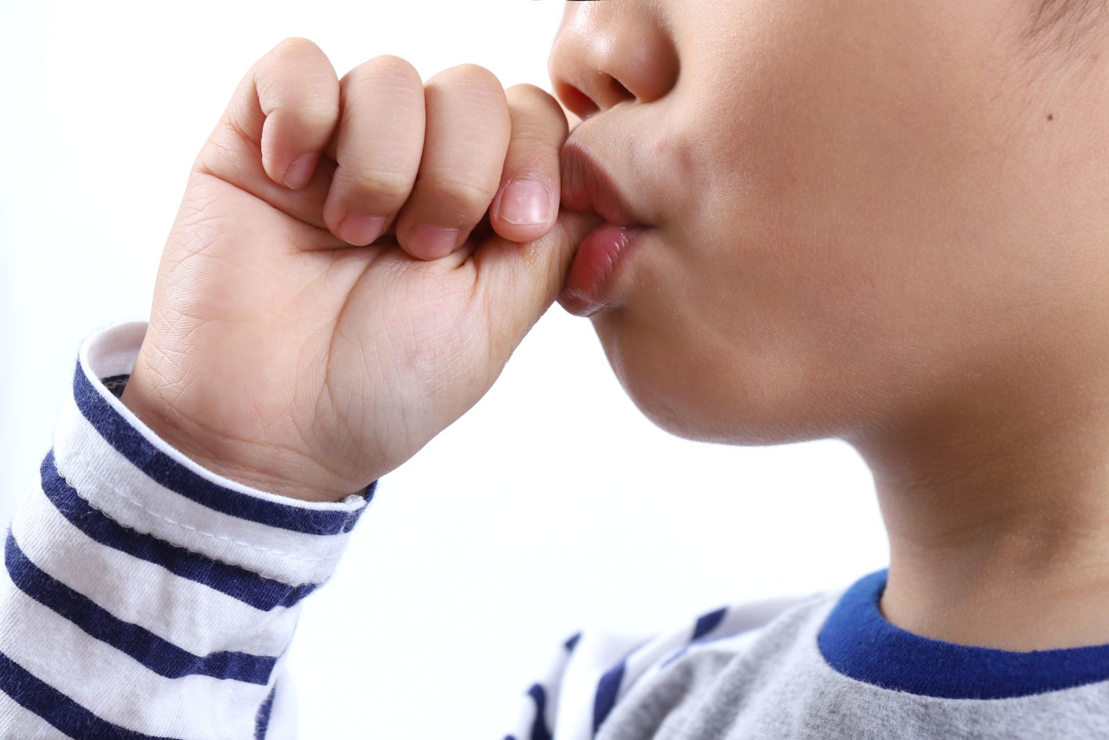 young boy sucking his thumb