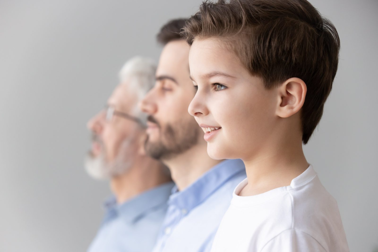 side profile of three generations of males