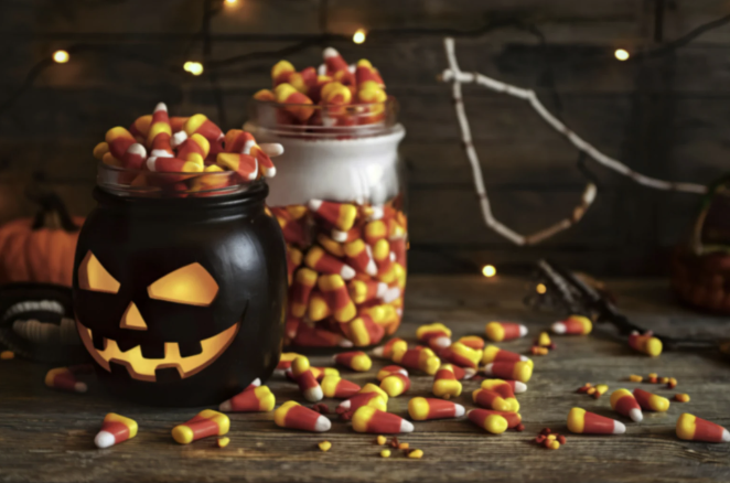 Halloween pumpkin filled with candy corn.