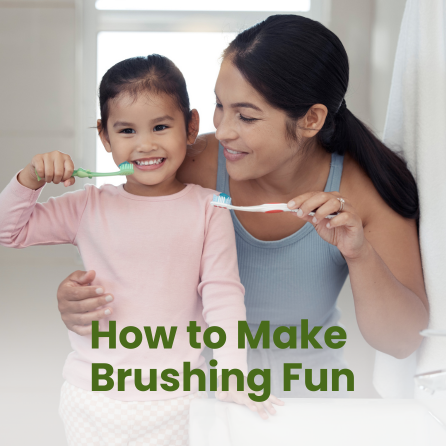 A mom is helping their child brush their teeth in a bathroom.