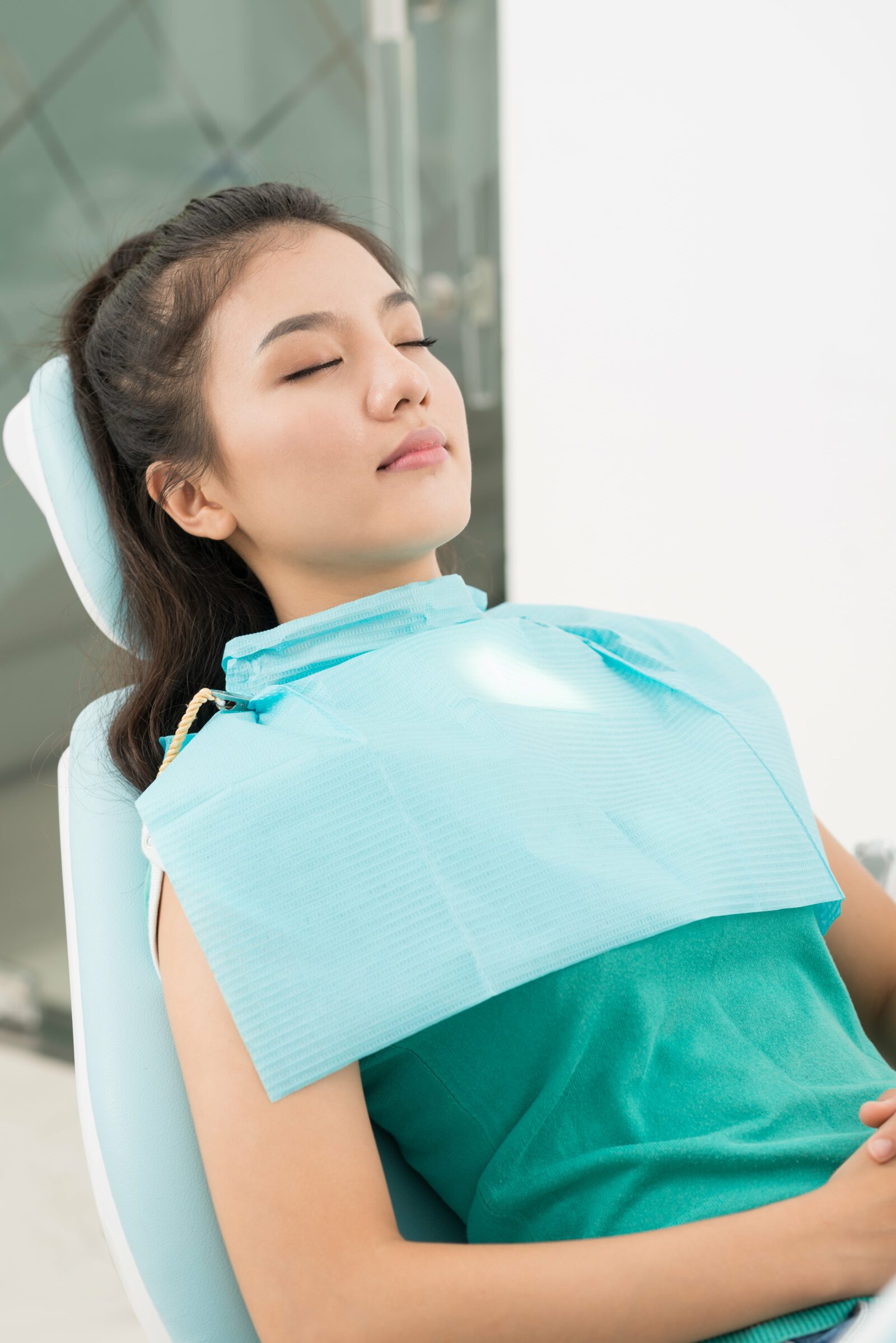 woman sleeping in dental chair