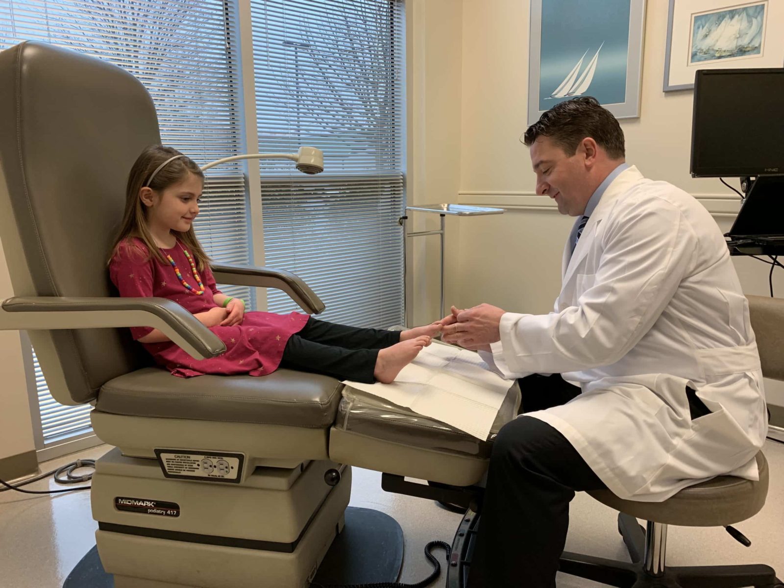 Dr. Rehm examining child