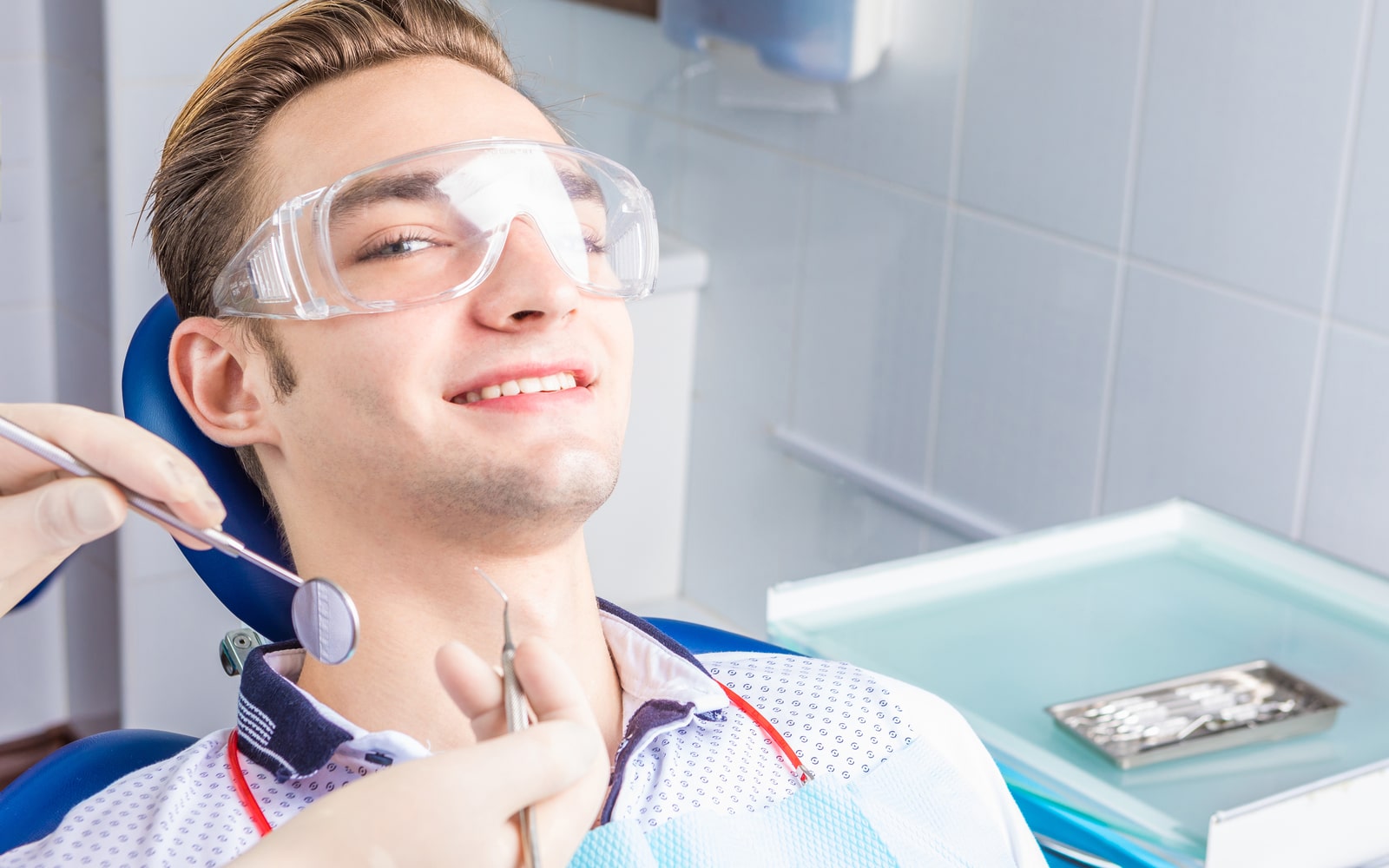 Man Smiling at Dentist