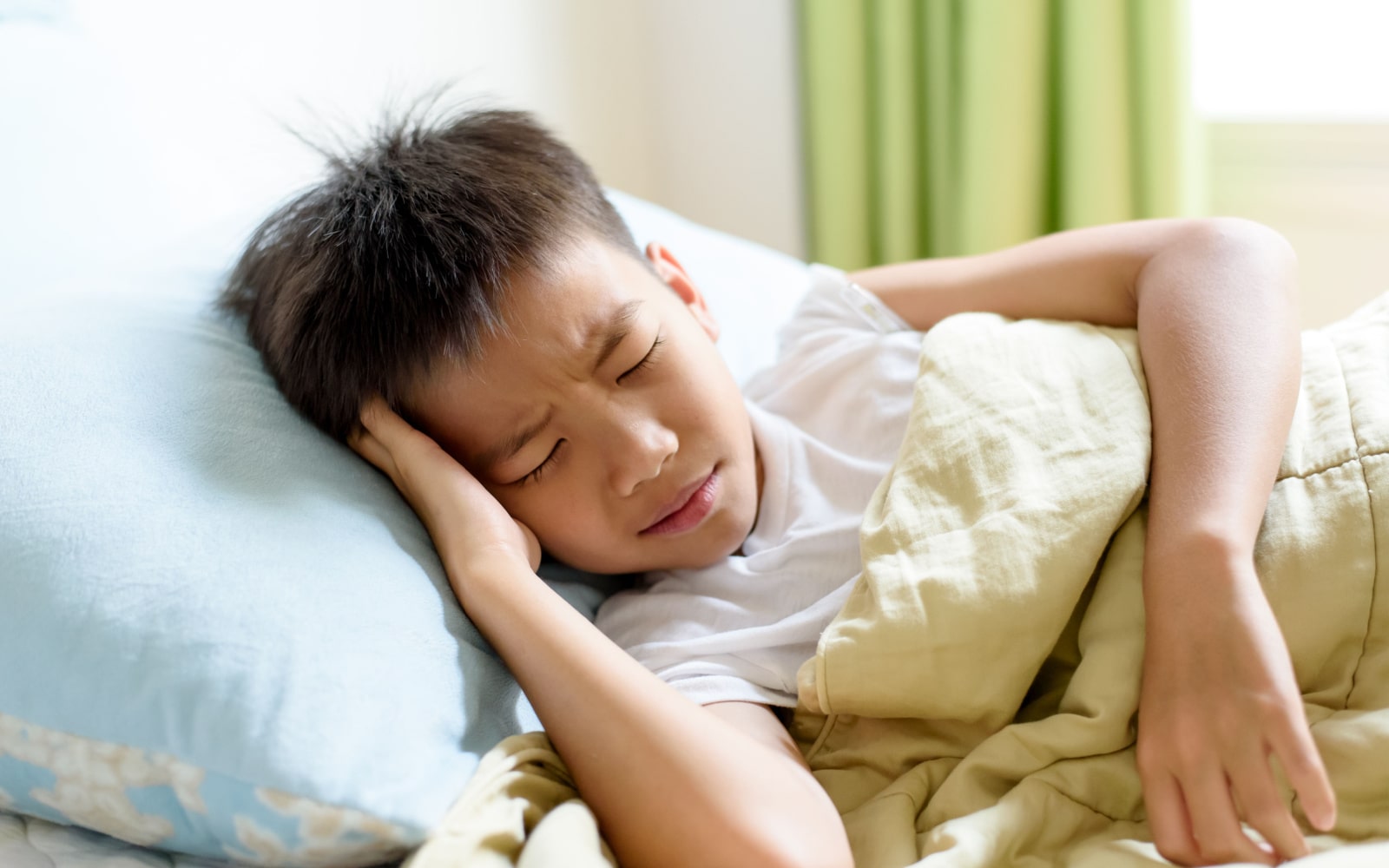 Child experiencing problems with sleep due to sleep apnea