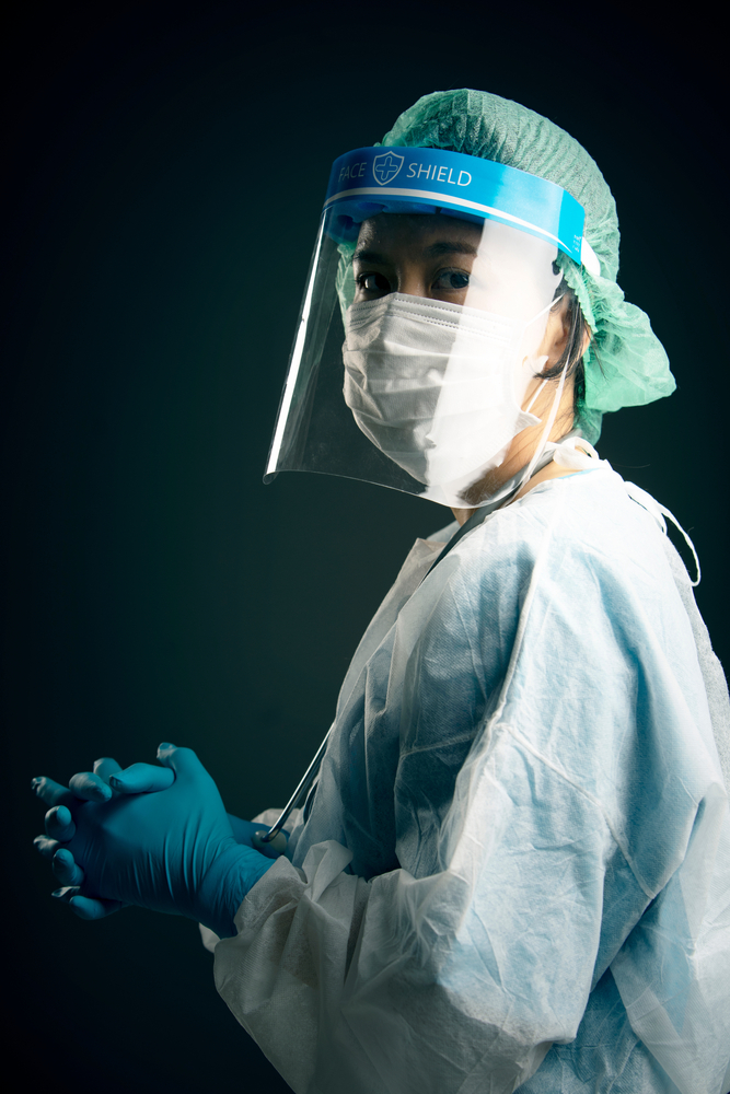 Woman in full ppe and face shield