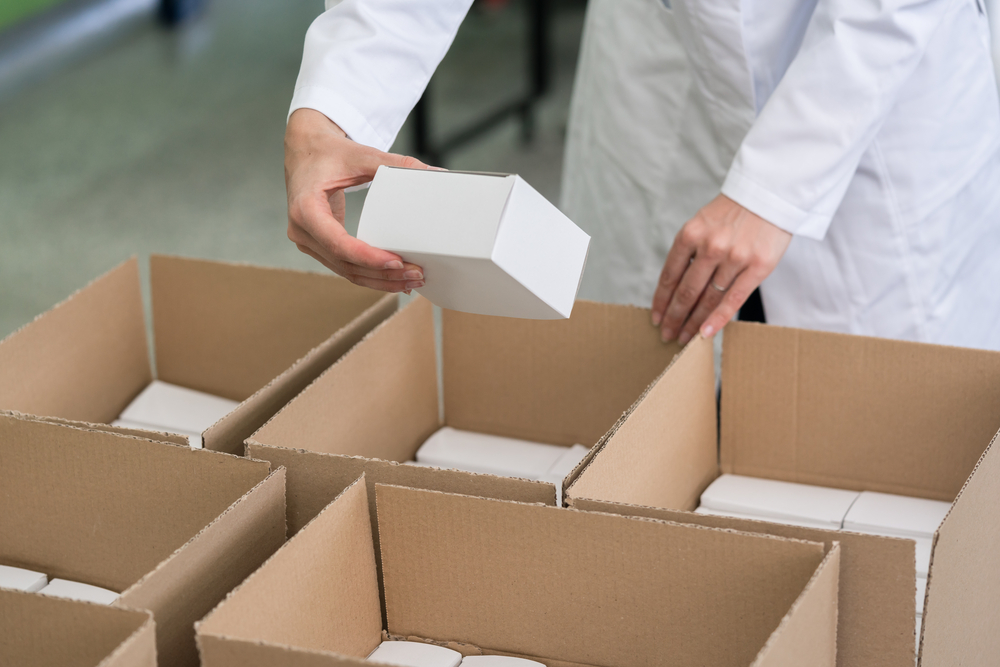 man packing boxes