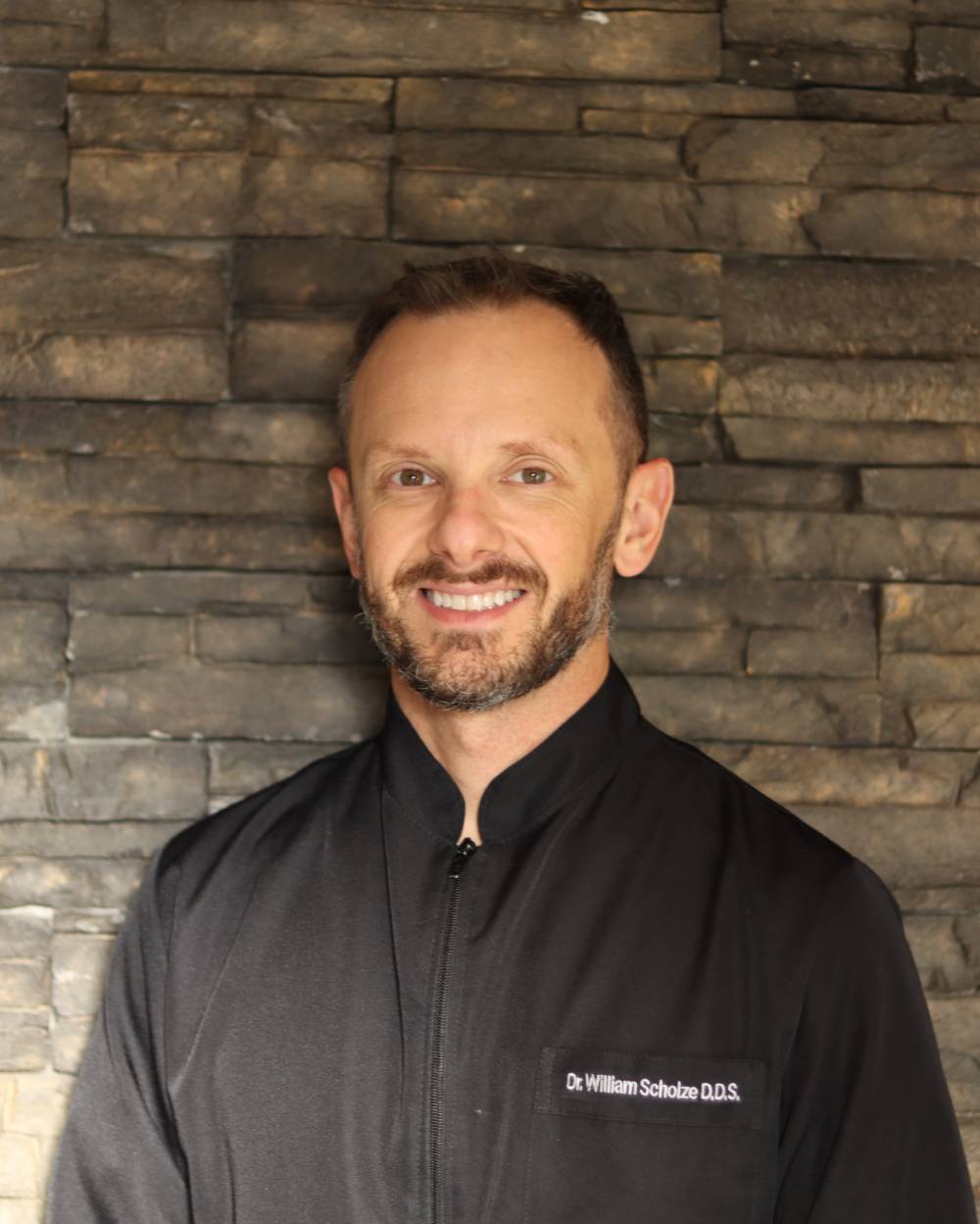 Dr. William Scholze DDS showing the concept of Our Team