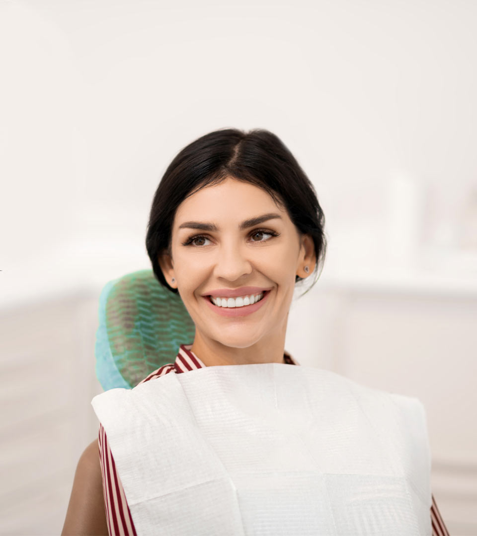 beautiful women smiling in dental chair