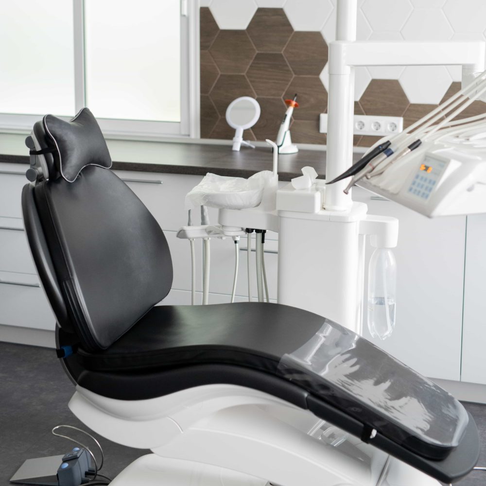 black dental chair cropped showing the concept of Home