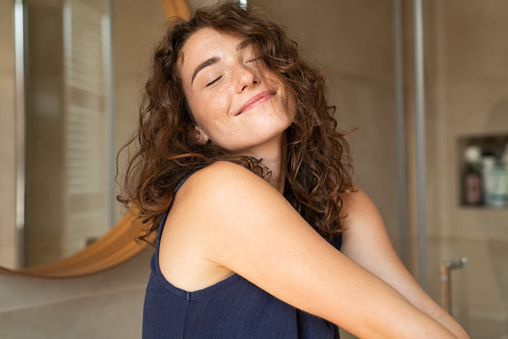 Young girl feeling happy and enjoying the day