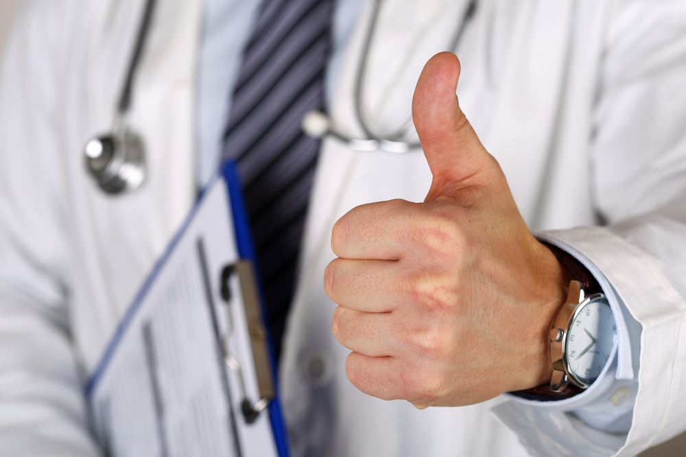 Doctor showing thumbs up sign