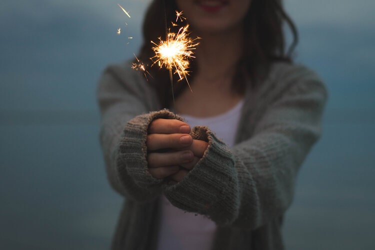 Girl and sparkler in her hand