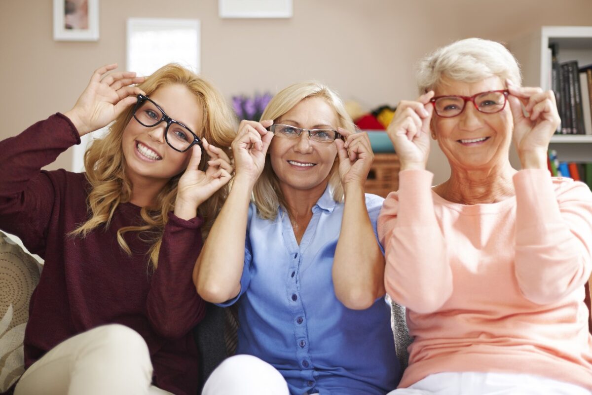 three generation of family posing with glasses