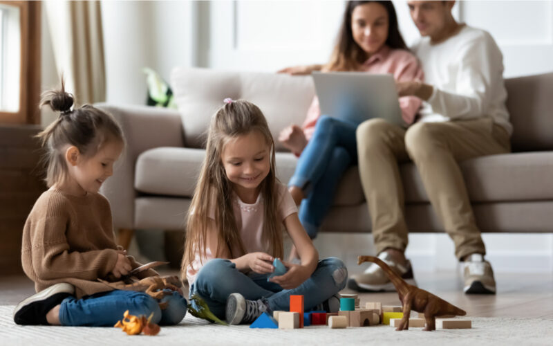 Family smiling indoors