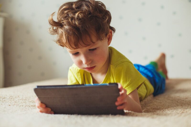 Child Interacting With Tablet