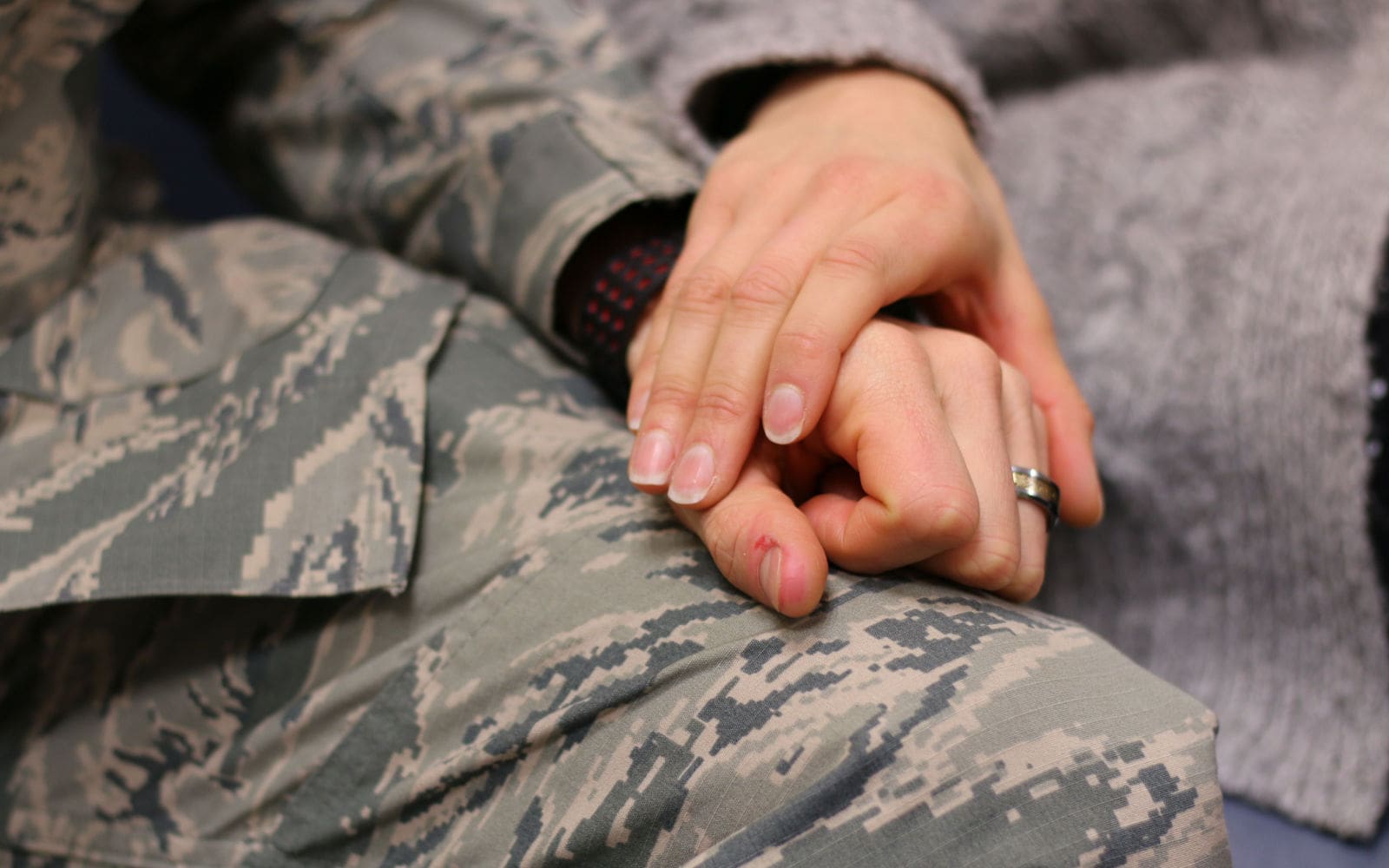 Military holding hands PTSD
