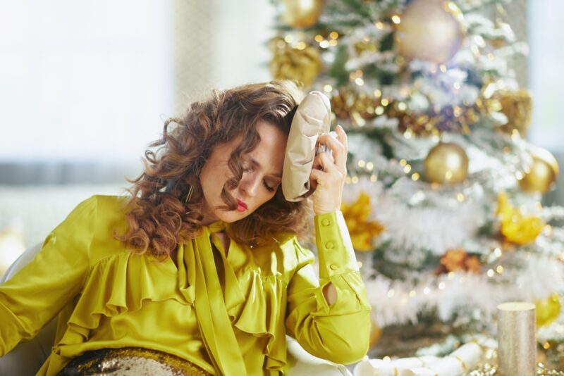Christmas tree, conveying fatigue or holiday discomfort