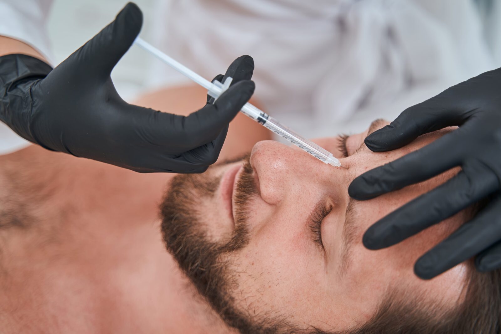 man having facial injections for skin rejuvenation
