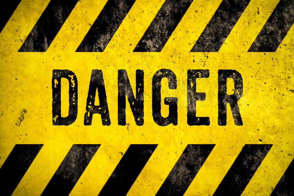 yellow and black danger sign