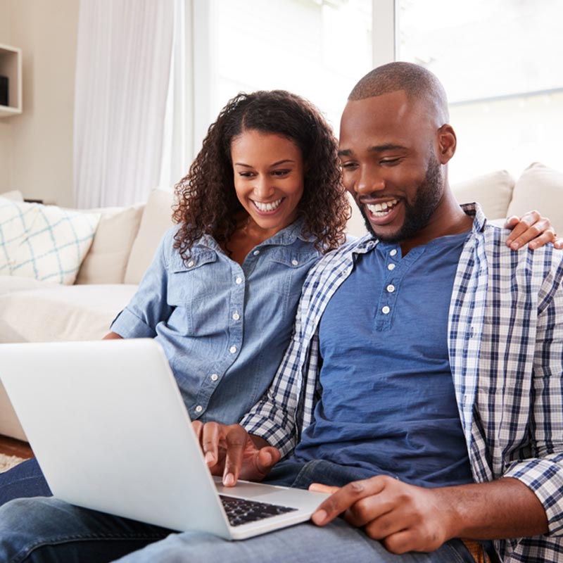Young couple using laptop