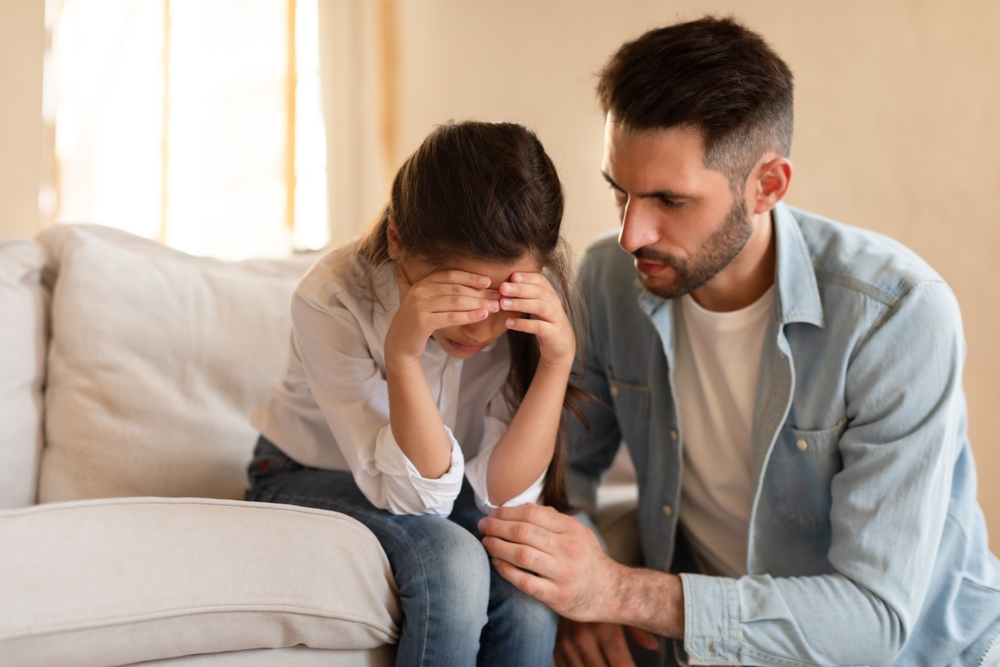 Parent helping child with emotional regulation