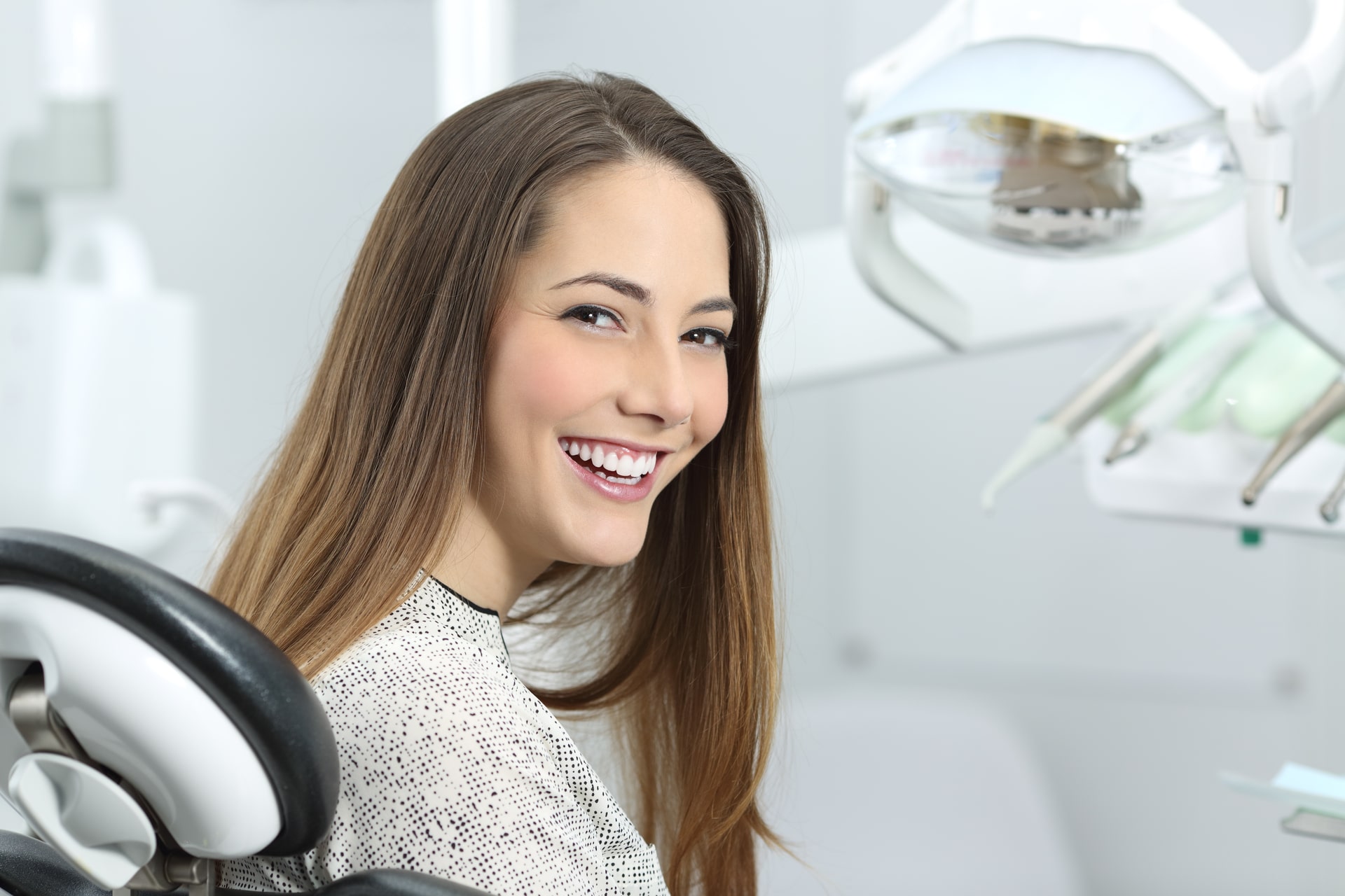 dentist patient showing her perfect smile