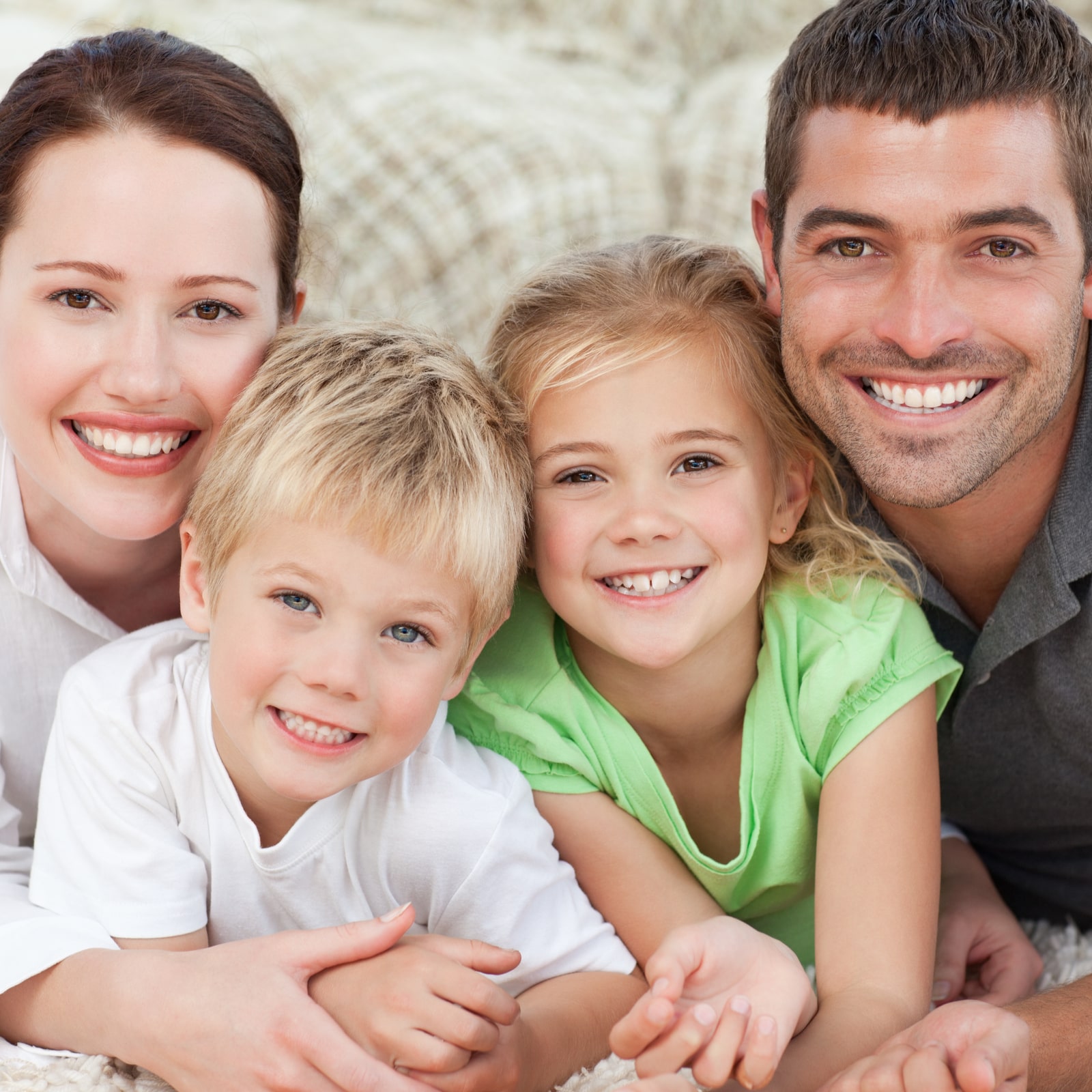 happy family lying on the floor at home