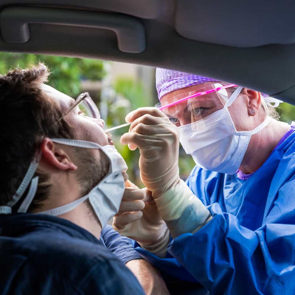 doctor taking medical test from person