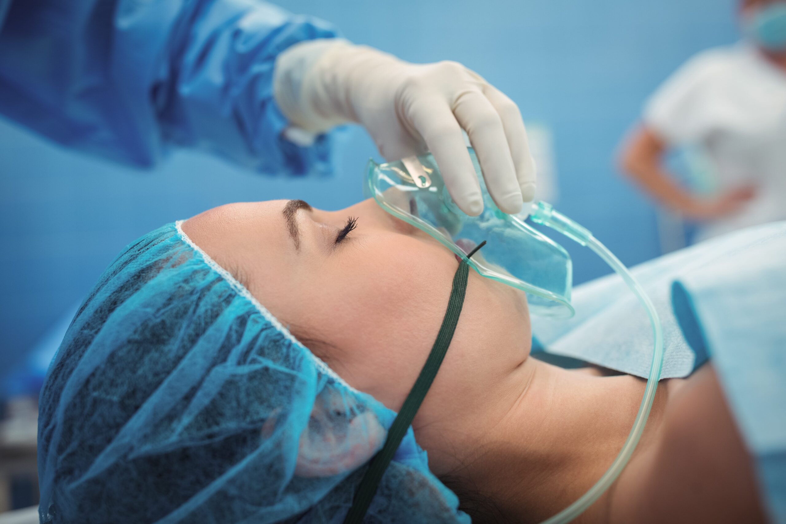 surgeon adjusting oxygen mask