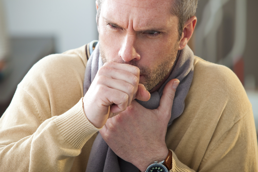 Man coughing, dealing with an Aging Voice