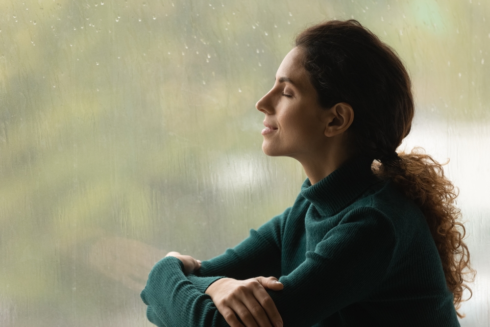 Women breathing deeply after receiving Sinus Headache Treatment