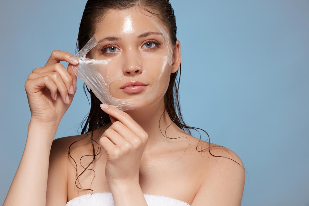attractive woman removing moisturizing mask similar to chemical peels