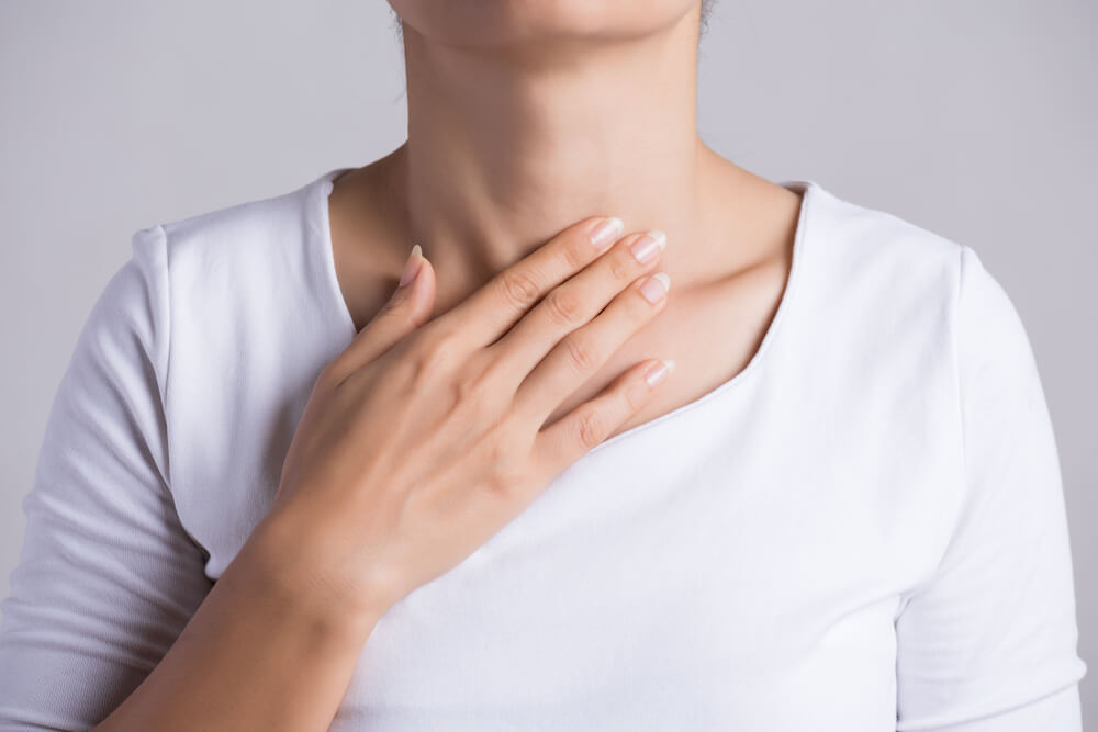 Young Woman Hand Touching Her Ill Neck