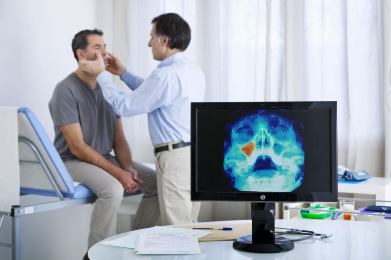 man being evaluated for sinus conditions