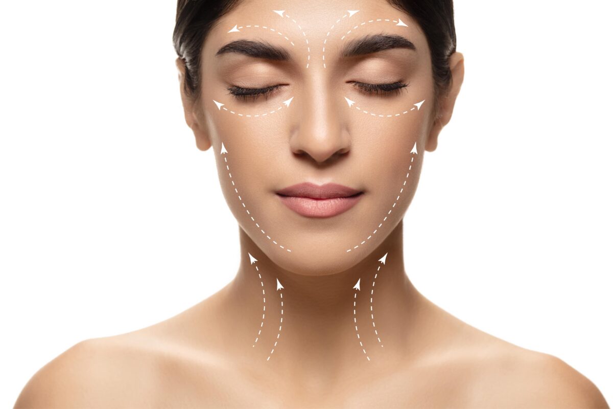 facelift concept with arrows on woman's face