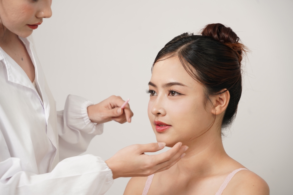 Asian,Female,Cosmetic,Surgeon,Touches,The Nose