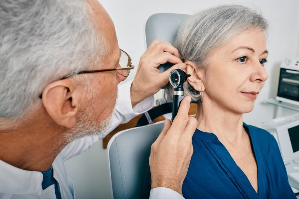 elderly woman getting her ears checked