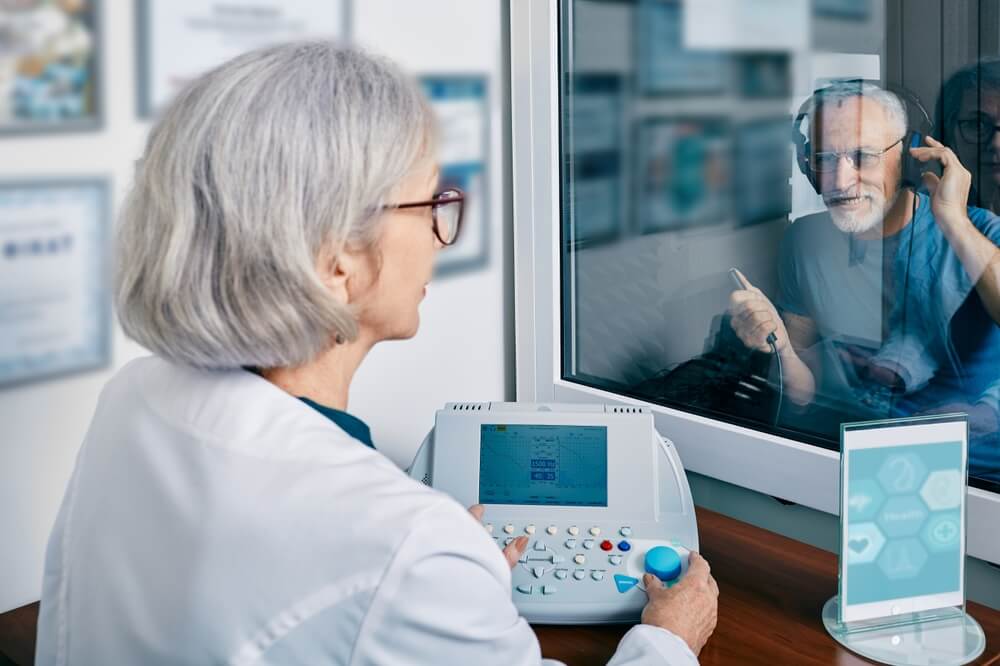 elderly man getting a hearing test