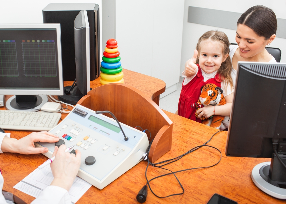 little girl getting a hearing test