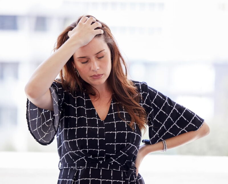 Business woman, stress and management with burnout or sad, hands and task in office.