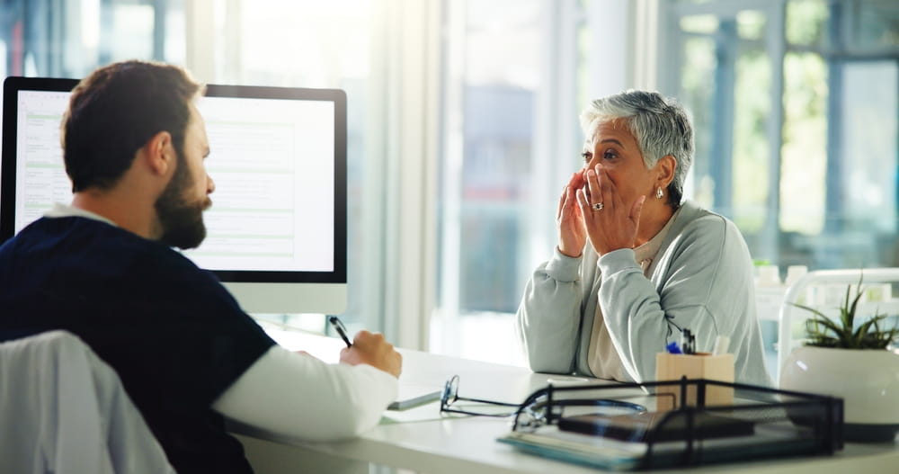 Doctor, patient and consultation with sinus for medical treatment, diagnosis or symptoms at clinic.