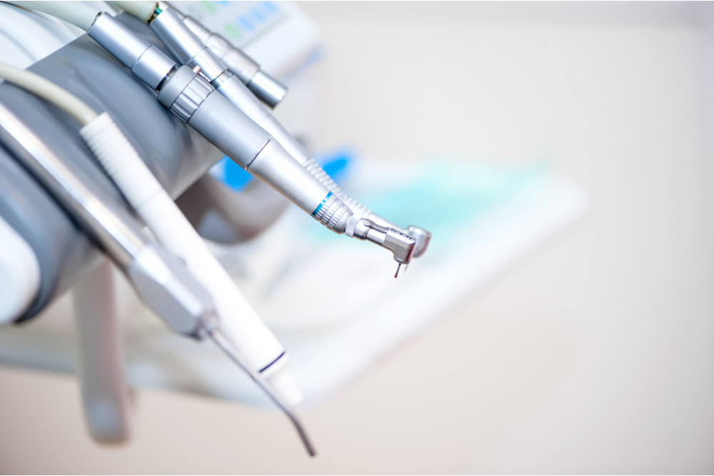 Dental tools on a dentist's chair with white background