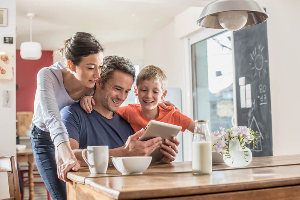 A Happy family using a digital tablet