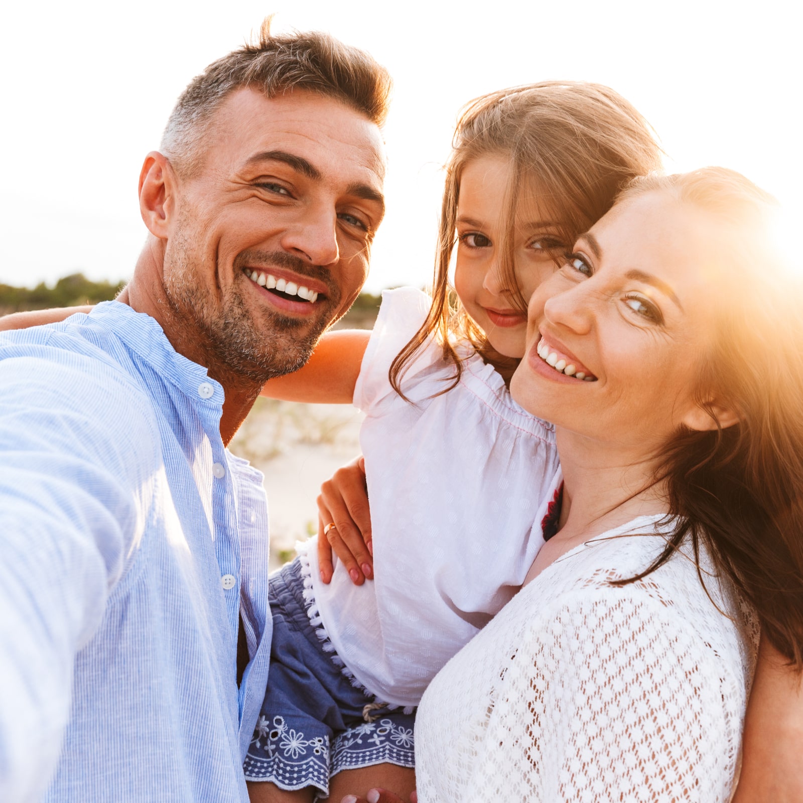 Happy family spending good time at the beach